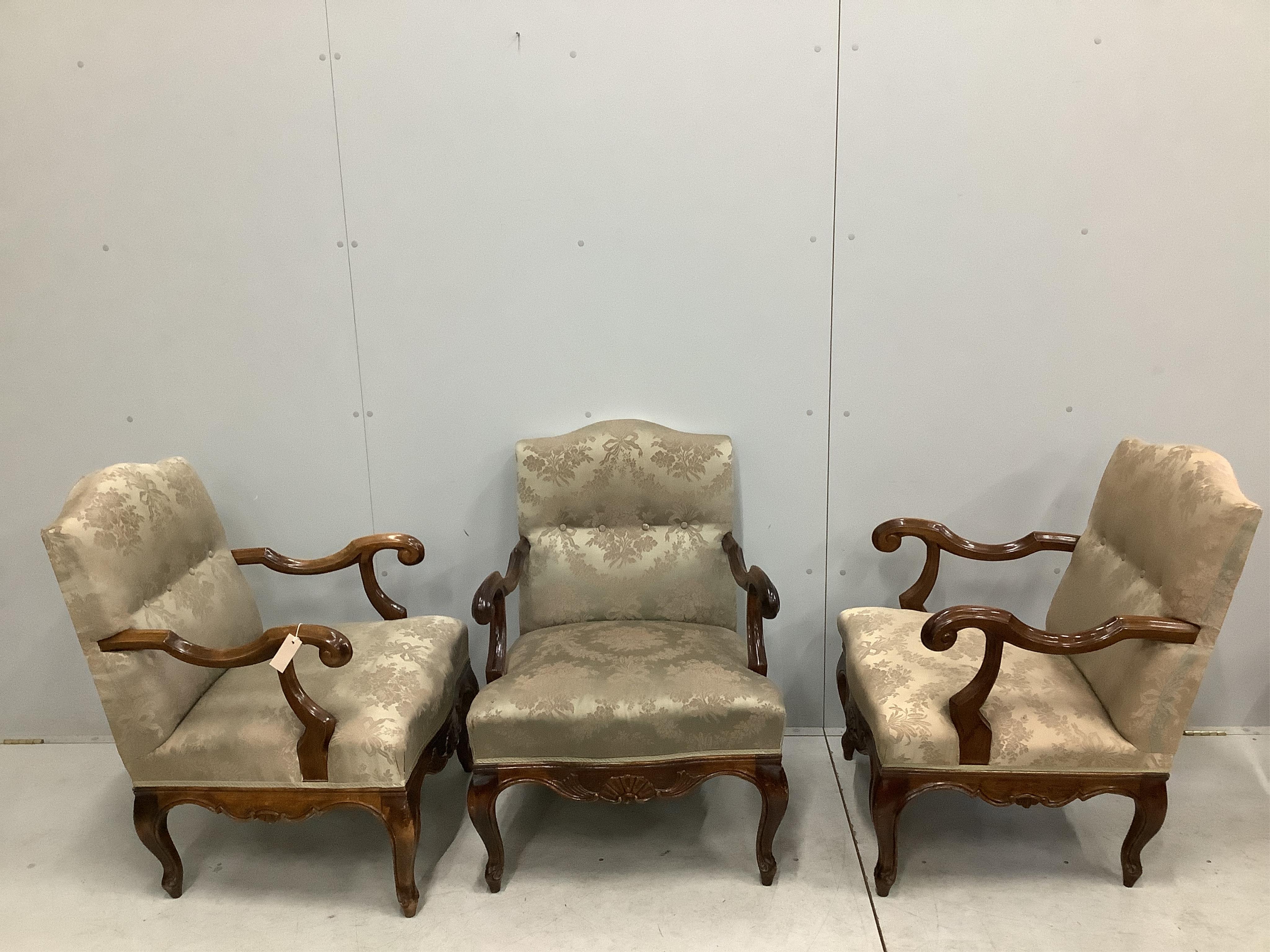 A set of three 18th century style carved walnut beech armchairs, width 59cm, depth 62cm, height 86cm. Condition - fair to good